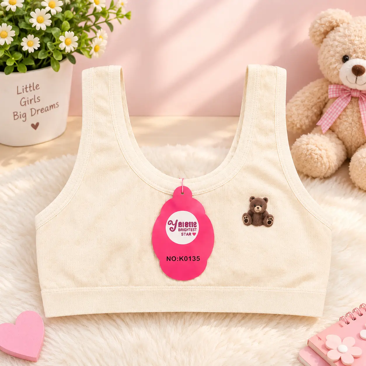 Beige girls’ starter sports bra with teddy bear detail and wide straps, free size